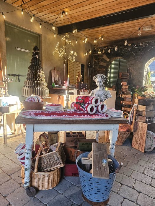 Red textile and vintage statue table display