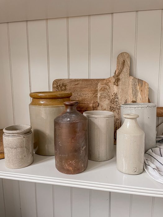 Antique stoneware crocks and chopping boards
